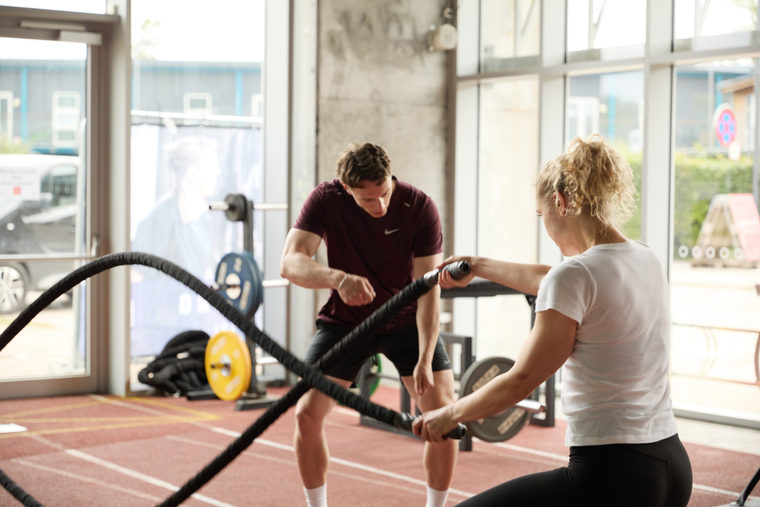 Athlete training with battle ropes